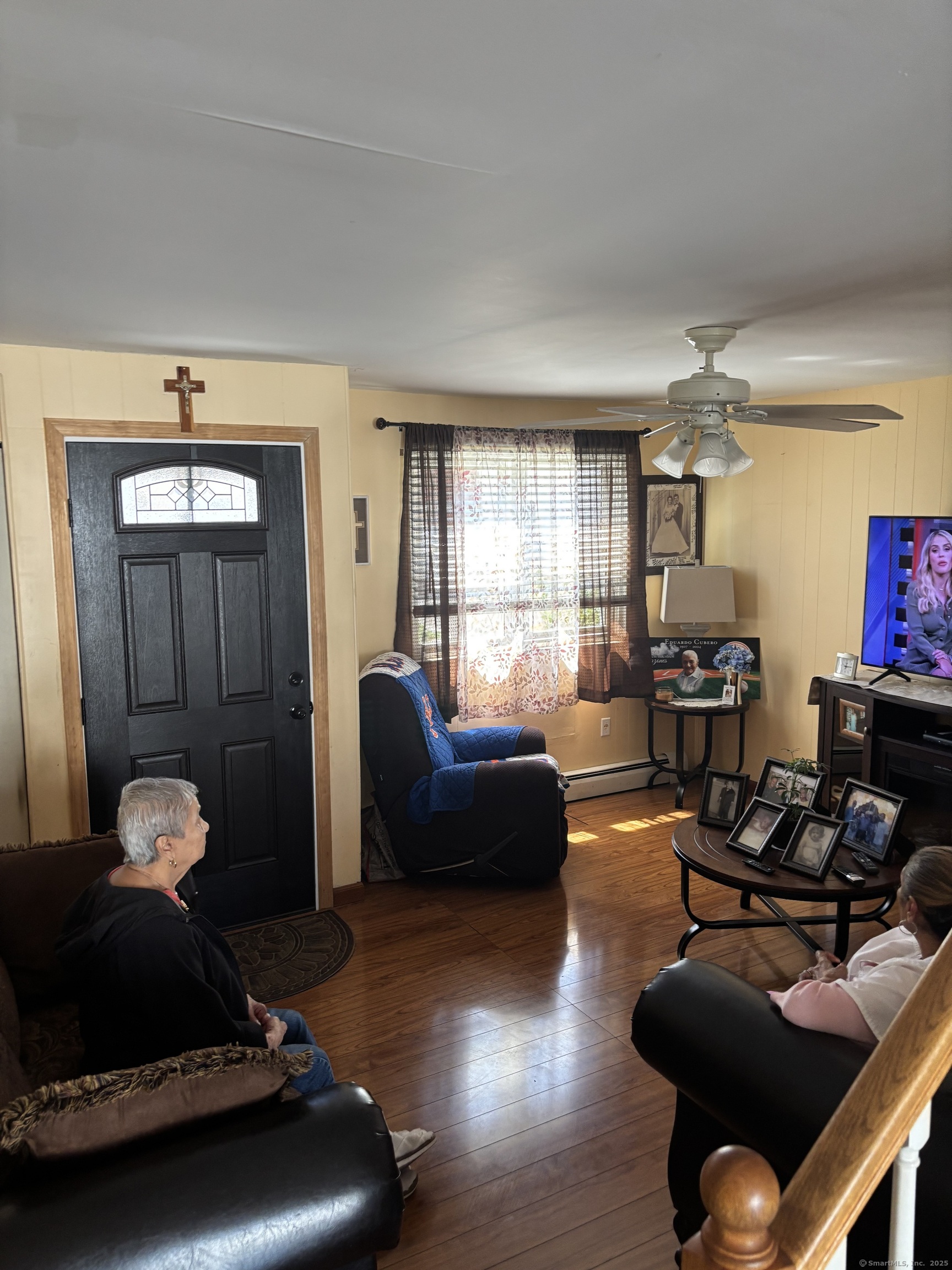 60 Gilmore Street, Unit 21 Bridgeport, CT 06608 - Photo 3 of 13 a living room with furniture a window and wooden floor
