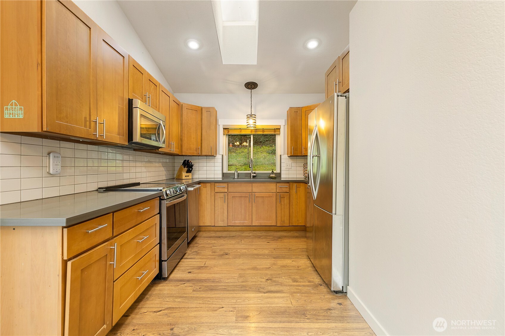 25122 Florence Acres Road Monroe, WA 98272 - Photo 13 of 30 a kitchen with stainless steel appliances granite countertop a sink and cabinets