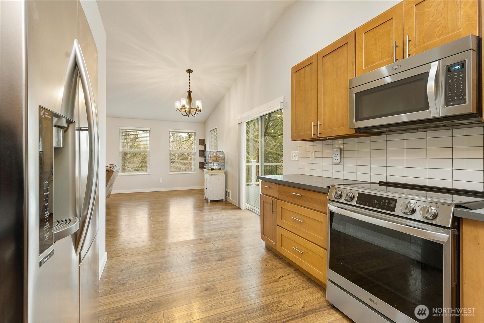 25122 Florence Acres Road Monroe, WA 98272 - Photo 14 of 30 a kitchen with stainless steel appliances granite countertop a stove microwave and refrigerator