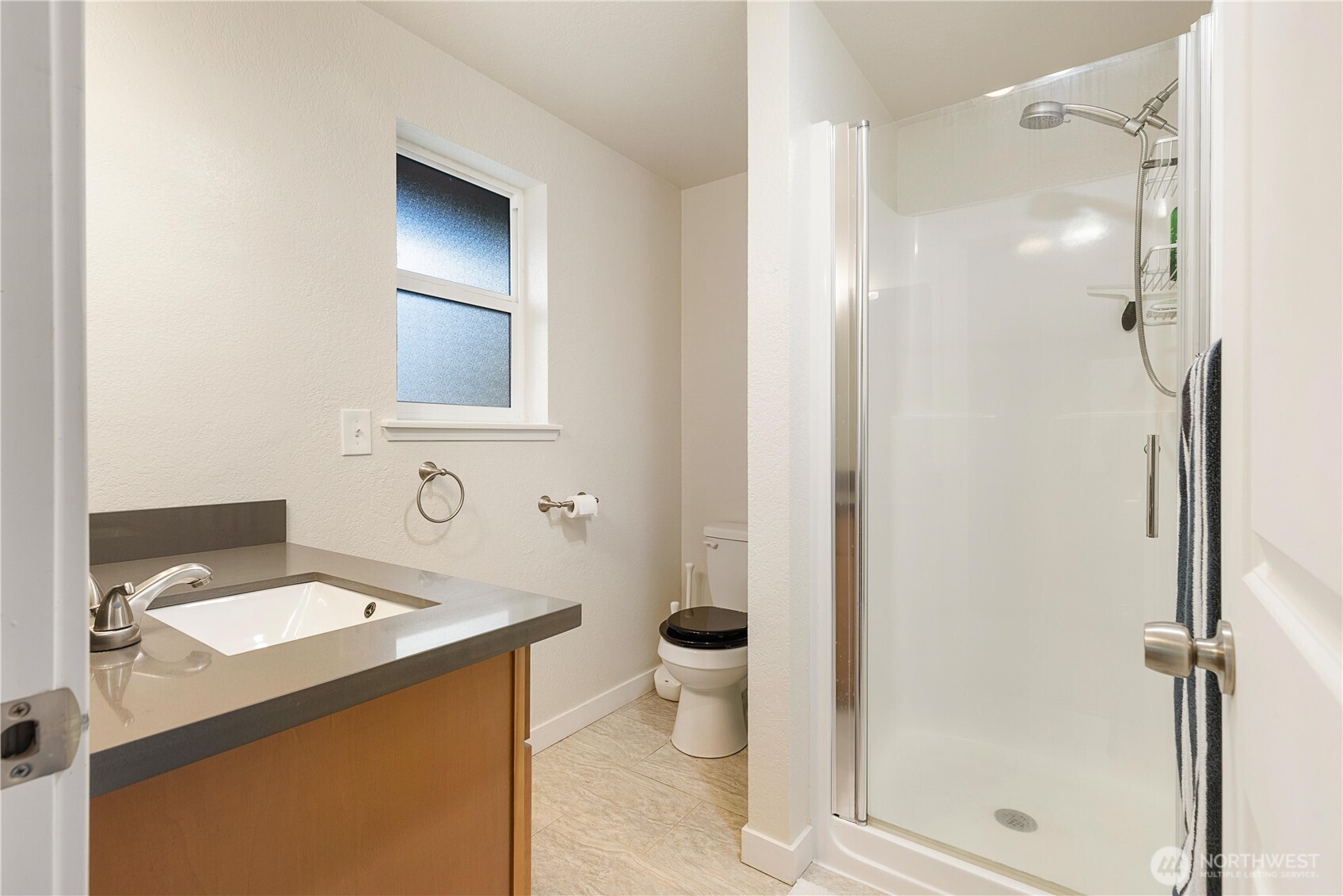 25122 Florence Acres Road Monroe, WA 98272 - Photo 16 of 30 a bathroom with a sink toilet and shower