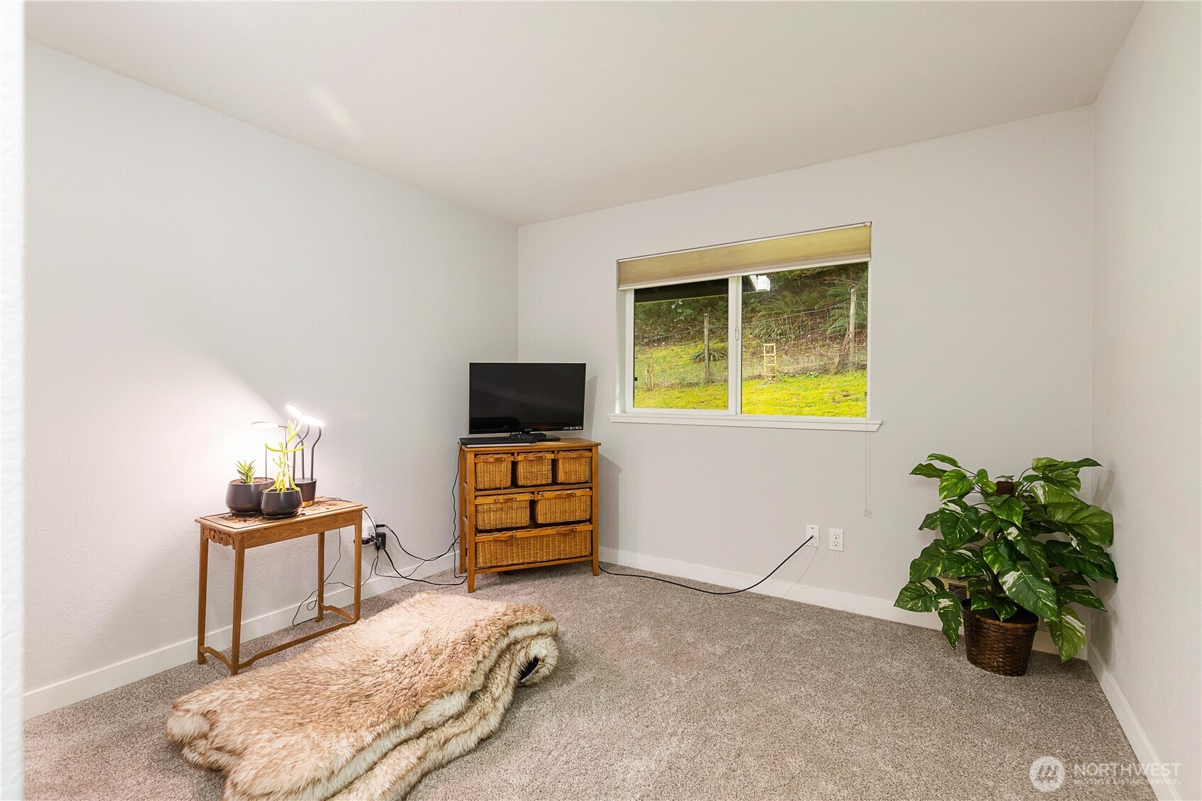 25122 Florence Acres Road Monroe, WA 98272 - Photo 18 of 30 a bedroom with a bed and a flat screen tv