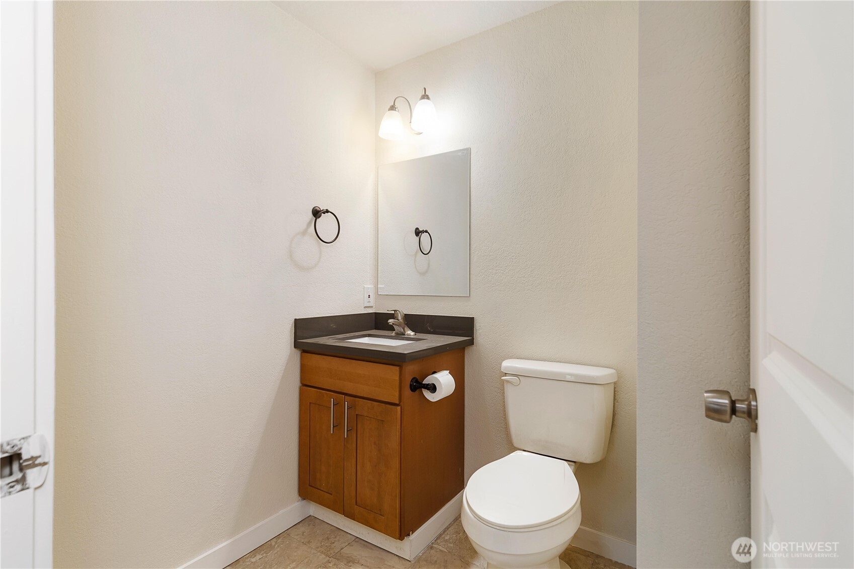 25122 Florence Acres Road Monroe, WA 98272 - Photo 24 of 30 a white toilet sitting next to a bathroom sink