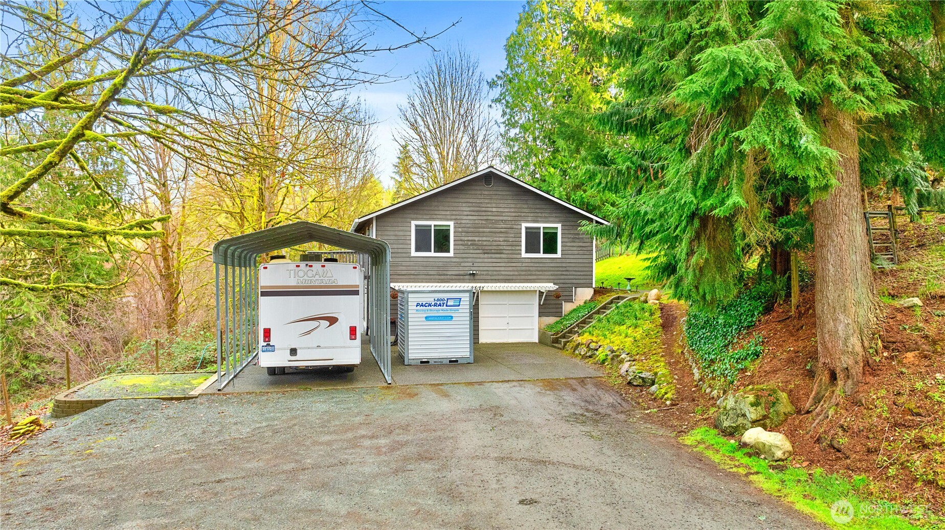 25122 Florence Acres Road Monroe, WA 98272 - Photo 4 of 30 a view of a house with a yard and garage