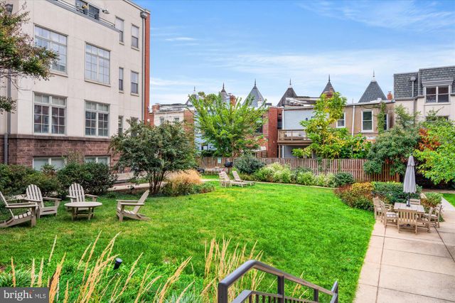 a view of a building next to a yard