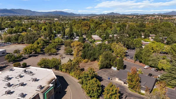 an aerial view of a house with a garden