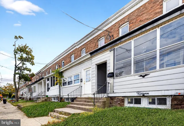 a view of house with yard