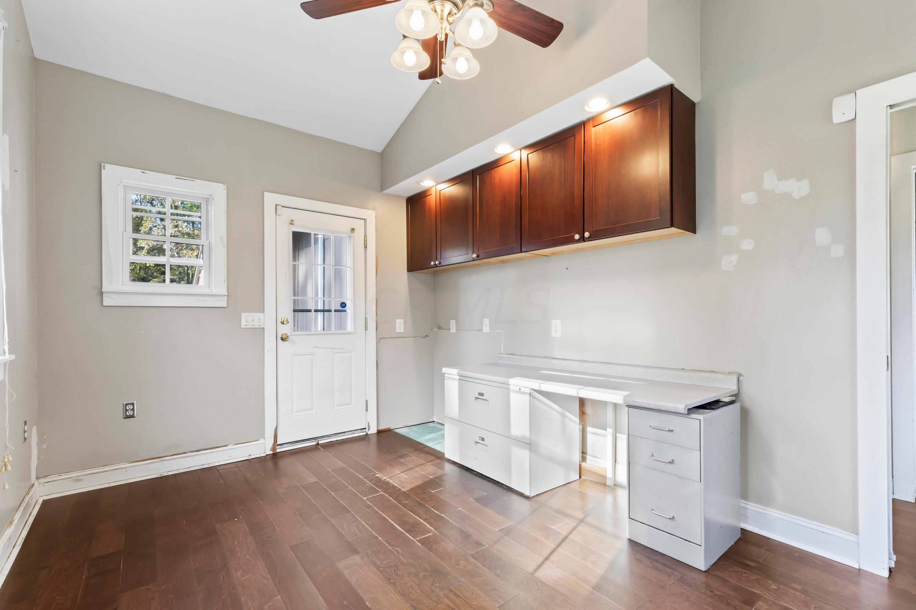 9495 Kilbourne Road Sunbury, OH 43074 - Photo 35 of 84 • New engineered hardwood
flooring May 2017
• Tan painted walls
• Lighted ceiling fan
• Coffered ceiling
• Window air conditioning
unit remains
• Wall cabinets
• Can lighting
• Door front walk/drive
• Built-in desk/counter
• Pendant lighting