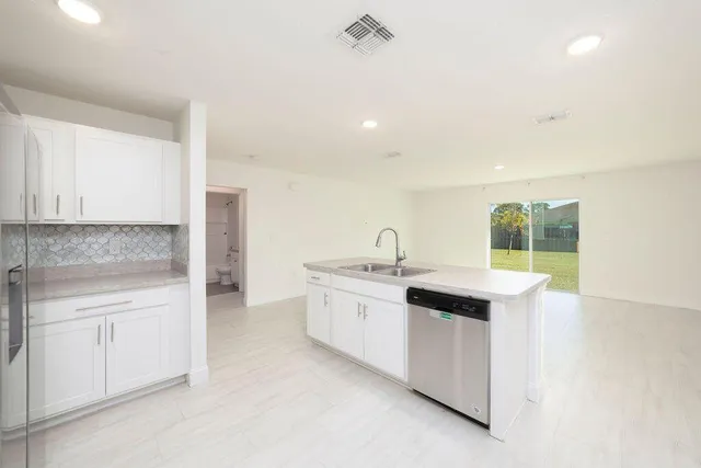 a kitchen with a sink and cabinets