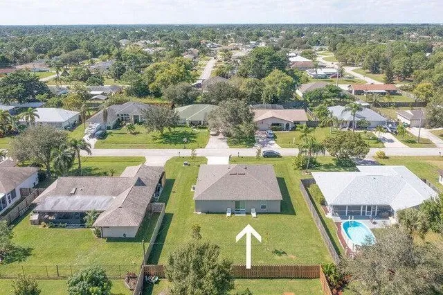 an aerial view of a house with a garden