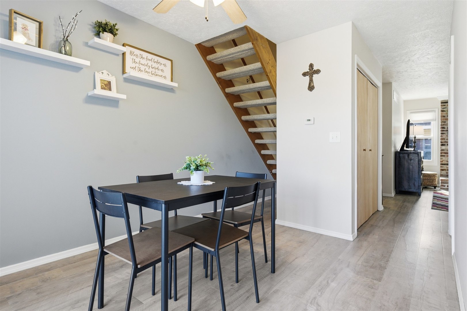 903 North Linden Street, Unit 108 Normal, IL 61761 - Photo 11 of 34 a view of a dining room with furniture and wooden floor