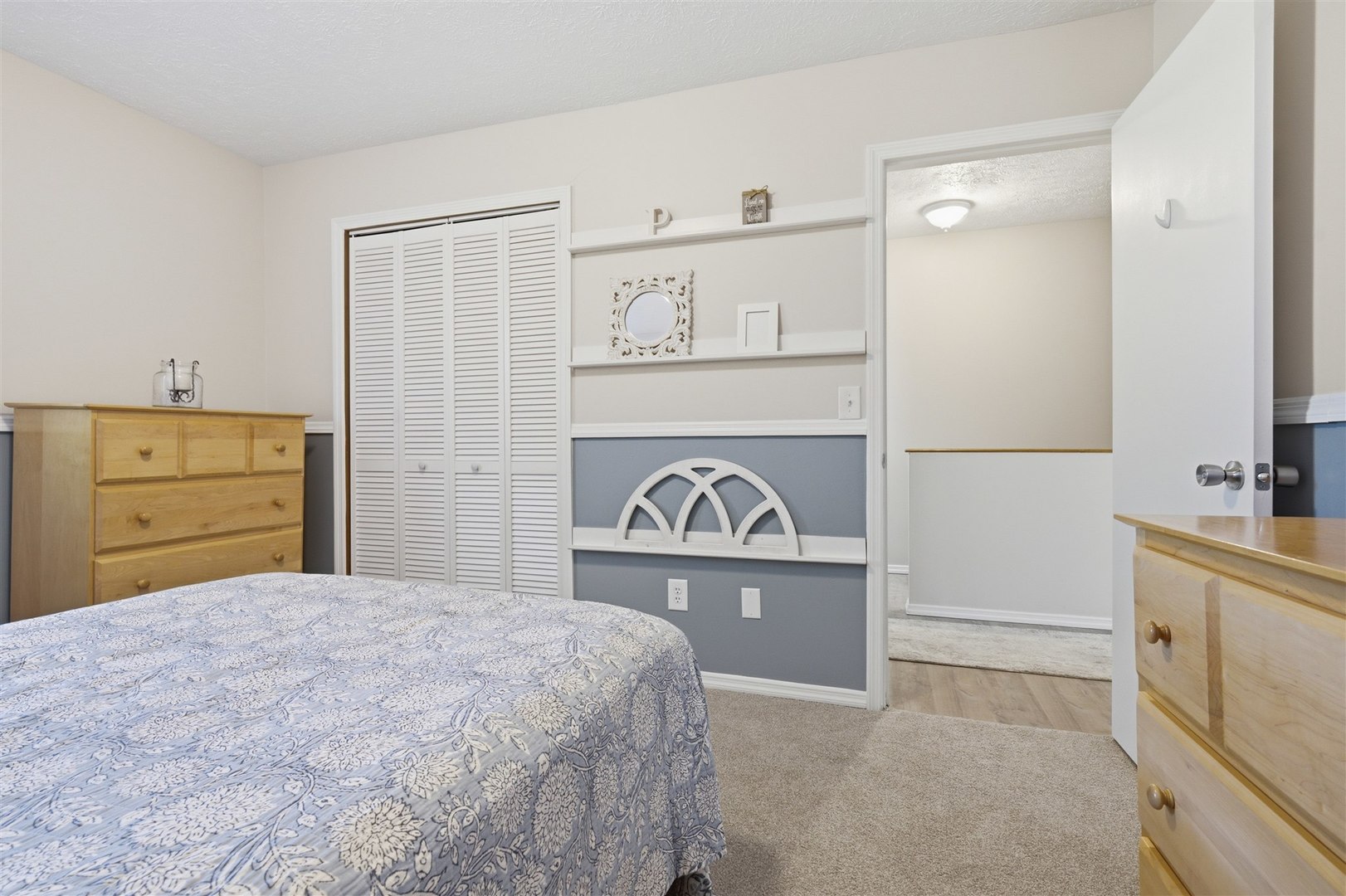 903 North Linden Street, Unit 108 Normal, IL 61761 - Photo 19 of 34 a bedroom with a bed and a dresser