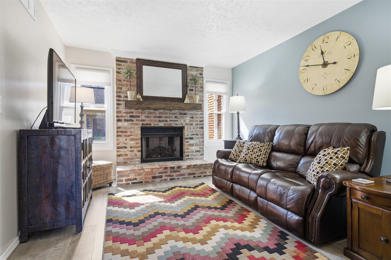 903 North Linden Street, Unit 108 Normal, IL 61761 - Photo 2 of 34 a living room with furniture and a fireplace