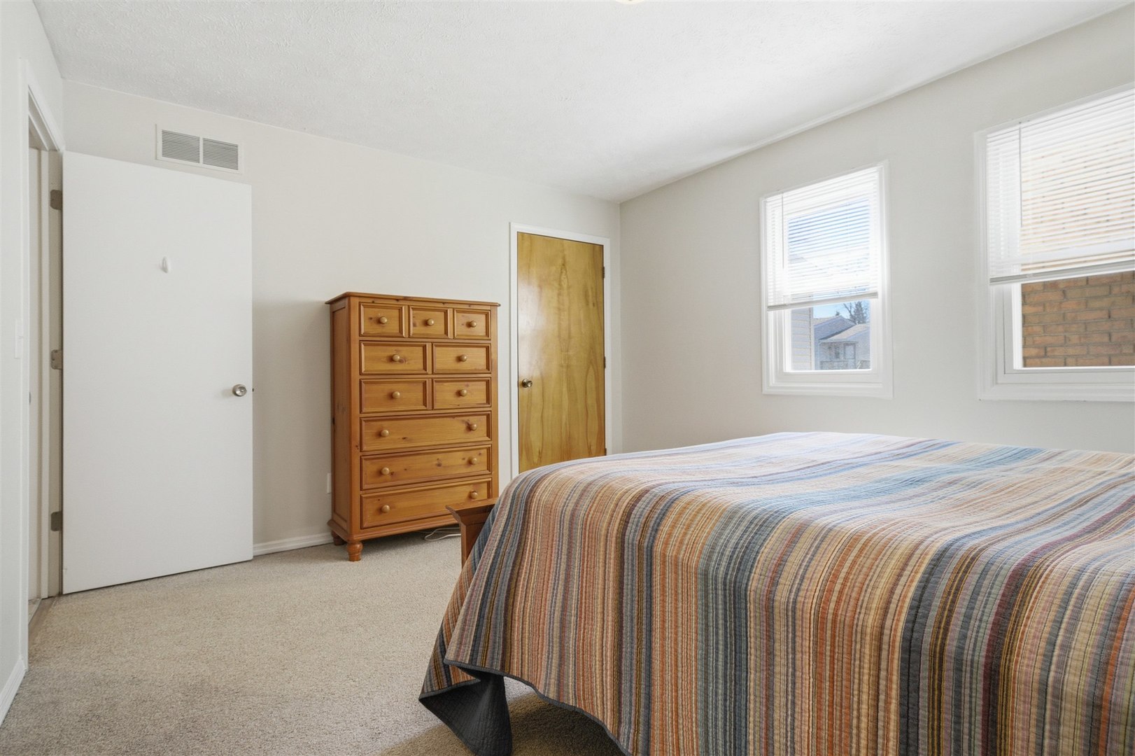 903 North Linden Street, Unit 108 Normal, IL 61761 - Photo 21 of 34 a bedroom with a bed and a closet