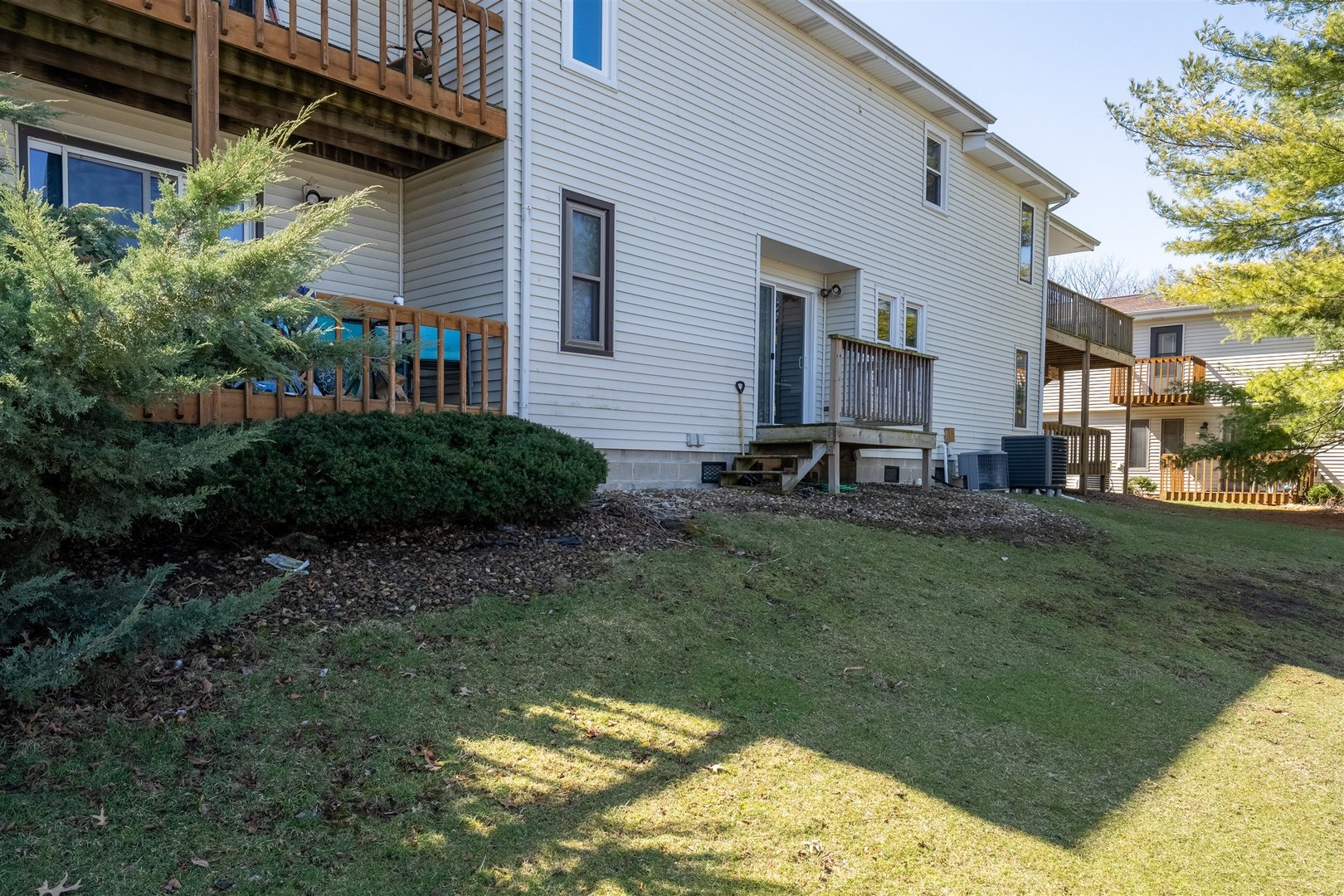 903 North Linden Street, Unit 108 Normal, IL 61761 - Photo 29 of 34 a backyard of a house with lots of green space