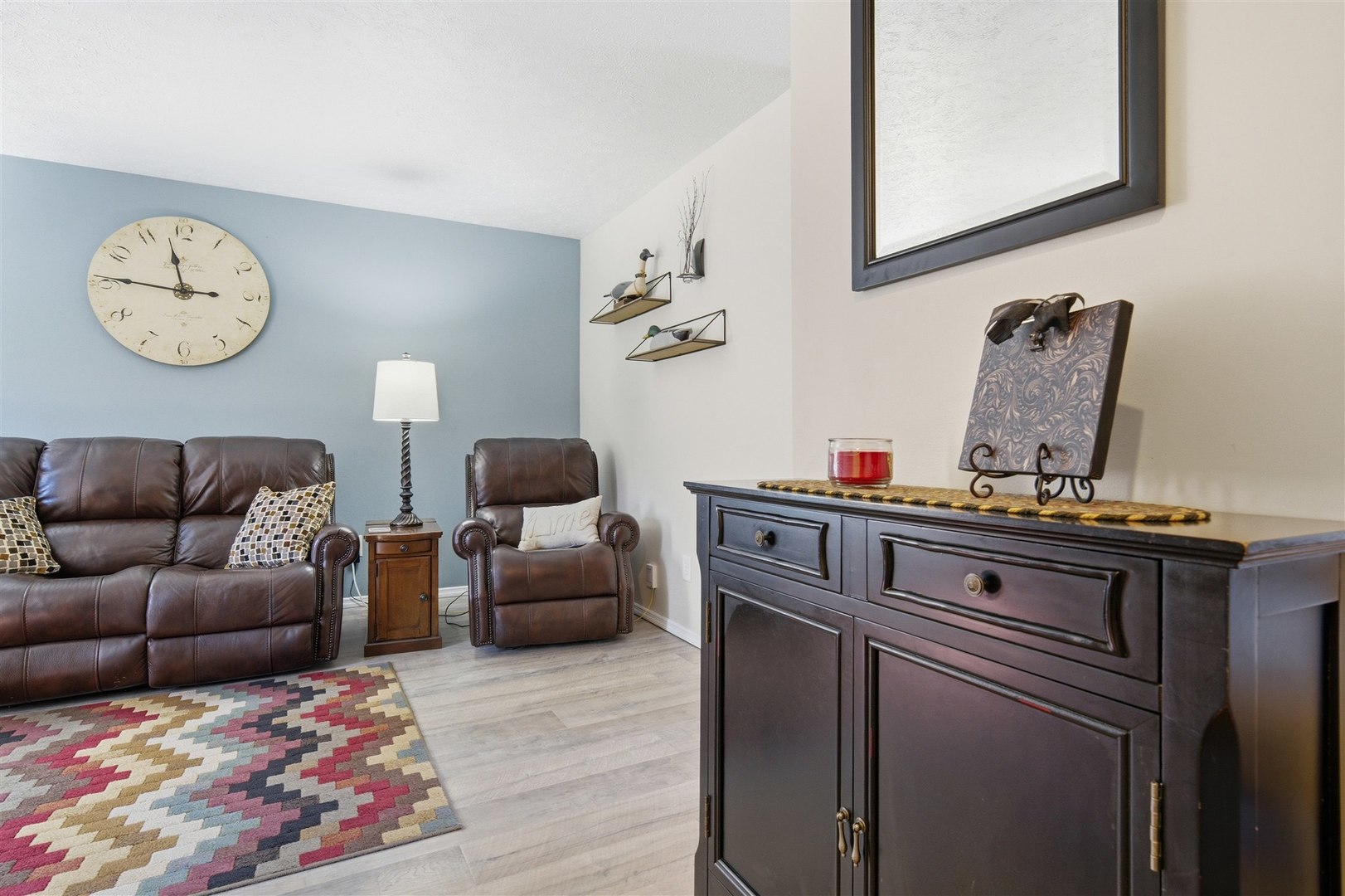 903 North Linden Street, Unit 108 Normal, IL 61761 - Photo 4 of 34 a living room with furniture a rug and a wall painting