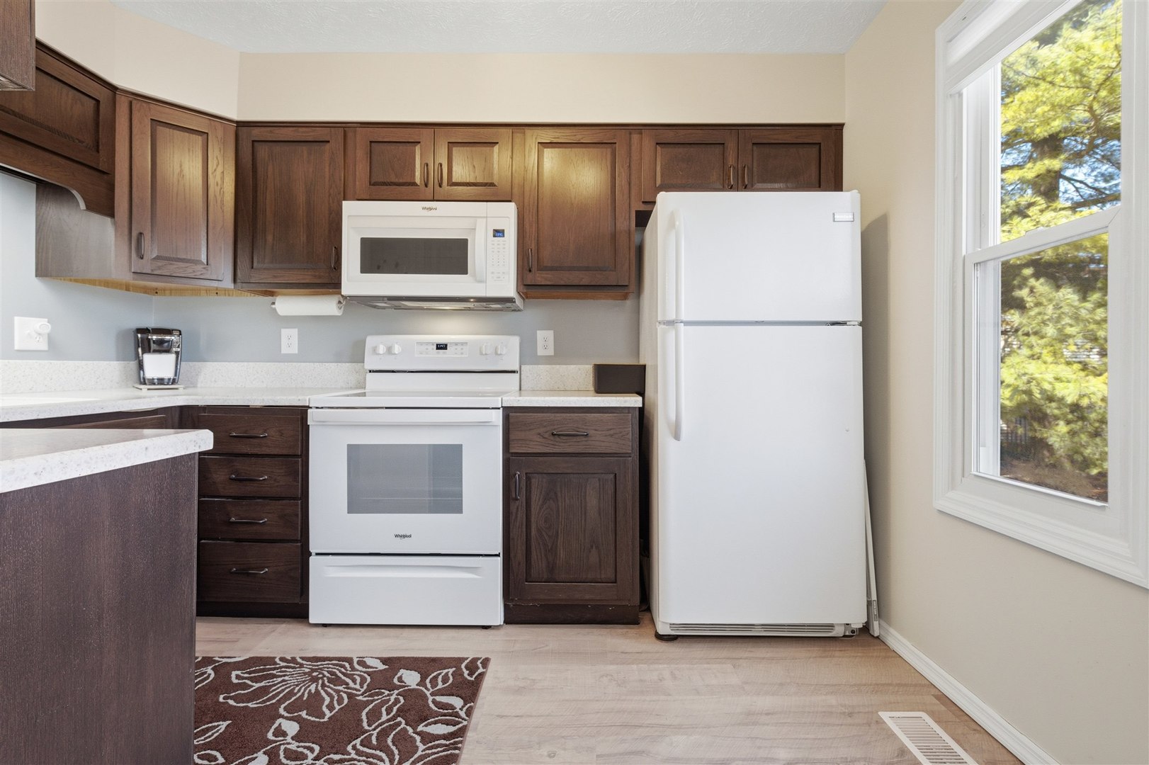 903 North Linden Street, Unit 108 Normal, IL 61761 - Photo 5 of 34 a kitchen with a refrigerator sink and stove