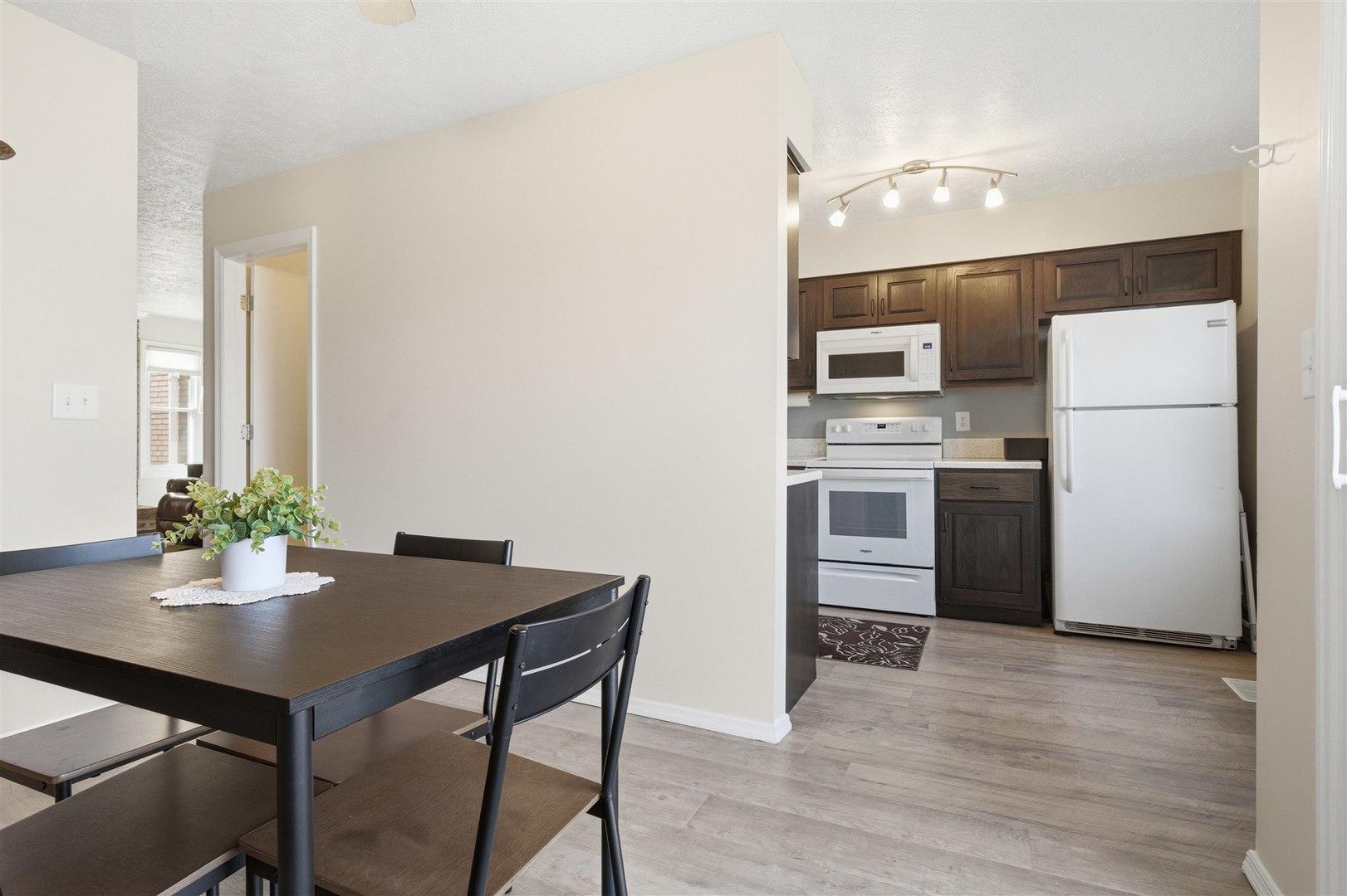 903 North Linden Street, Unit 108 Normal, IL 61761 - Photo 7 of 34 a kitchen with a table and chairs
