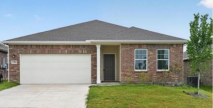 1301 Elliott Road Howe, TX 75459 - Photo 1 of 27 Brick facade with white trim, a dark entry door, and a two-car garage