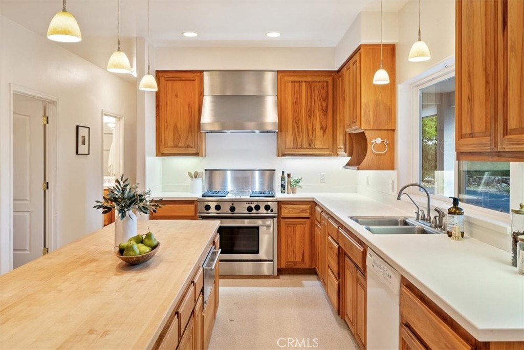 4242 Las Tablas Willow Creek Road Paso Robles, CA 93446 - Photo 16 of 58 a kitchen with a sink stove and cabinets