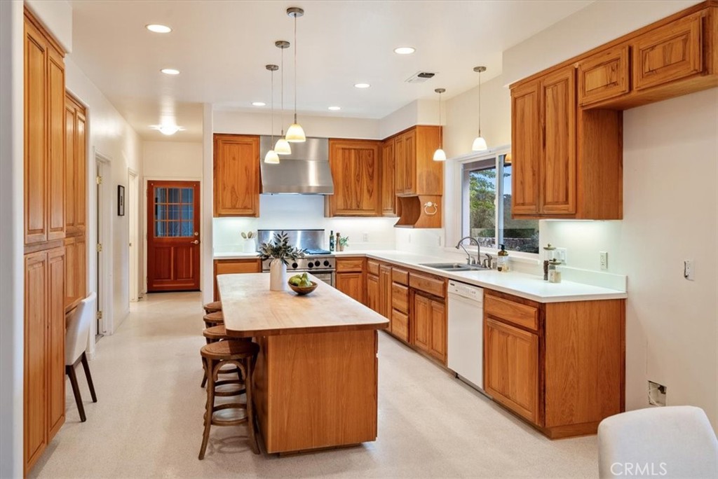 4242 Las Tablas Willow Creek Road Paso Robles, CA 93446 - Photo 17 of 58 a large kitchen with kitchen island a sink stainless steel appliances and cabinets