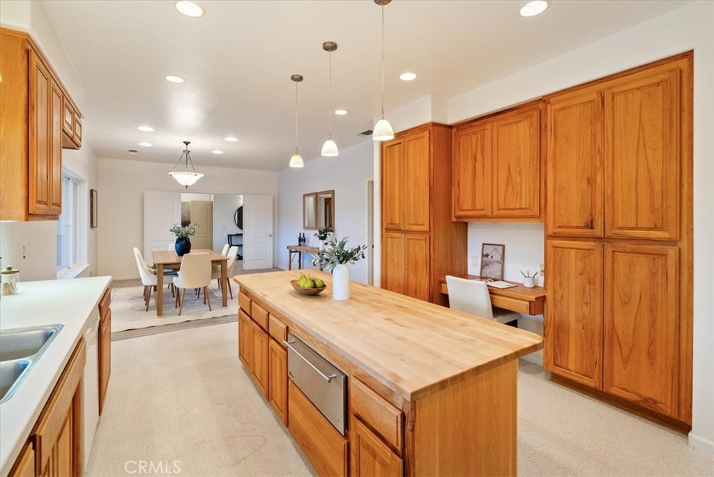4242 Las Tablas Willow Creek Road Paso Robles, CA 93446 - Photo 19 of 58 a large kitchen with kitchen island a sink a counter top space and living room view