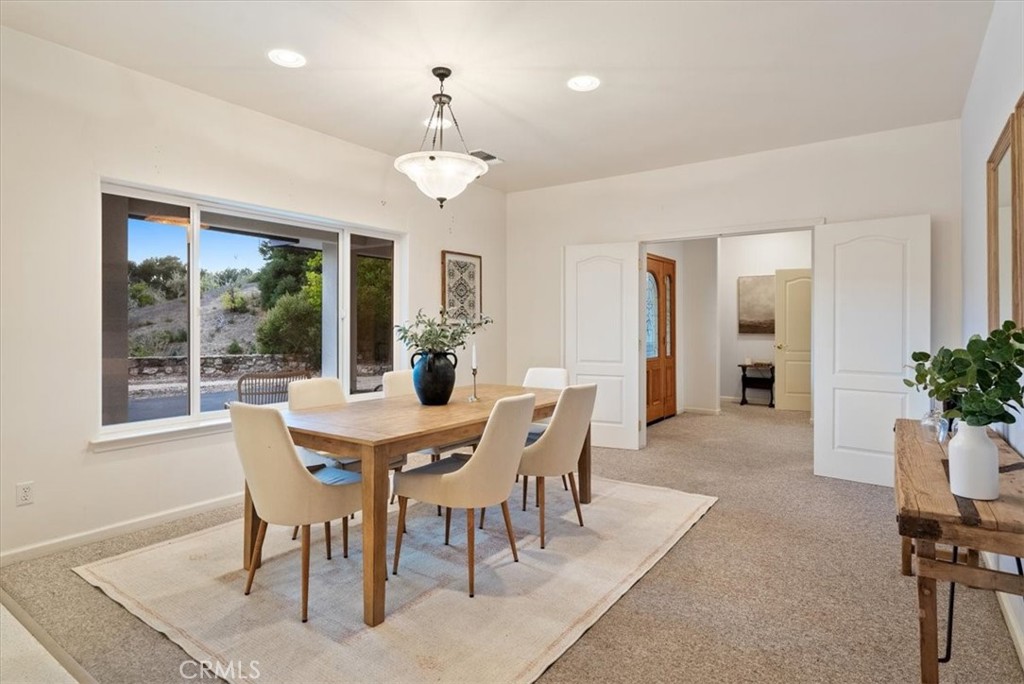 4242 Las Tablas Willow Creek Road Paso Robles, CA 93446 - Photo 21 of 58 a view of a dining room with furniture window and outside view