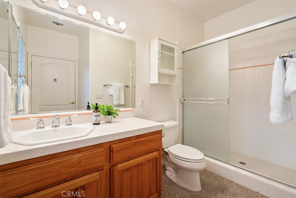 4242 Las Tablas Willow Creek Road Paso Robles, CA 93446 - Photo 30 of 58 a bathroom with a sink a toilet and shower