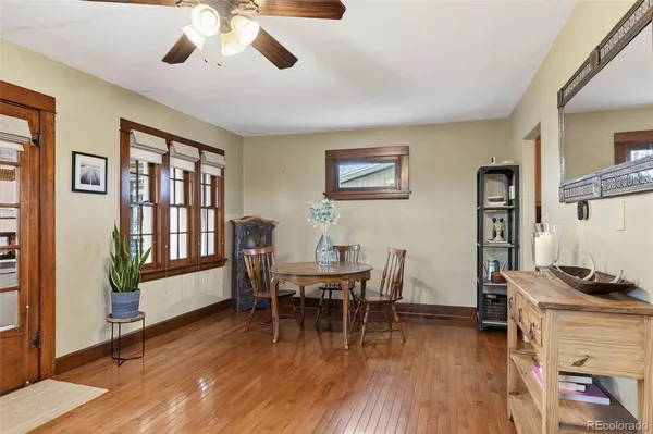 a view of a dining room with furniture window and wooden floor