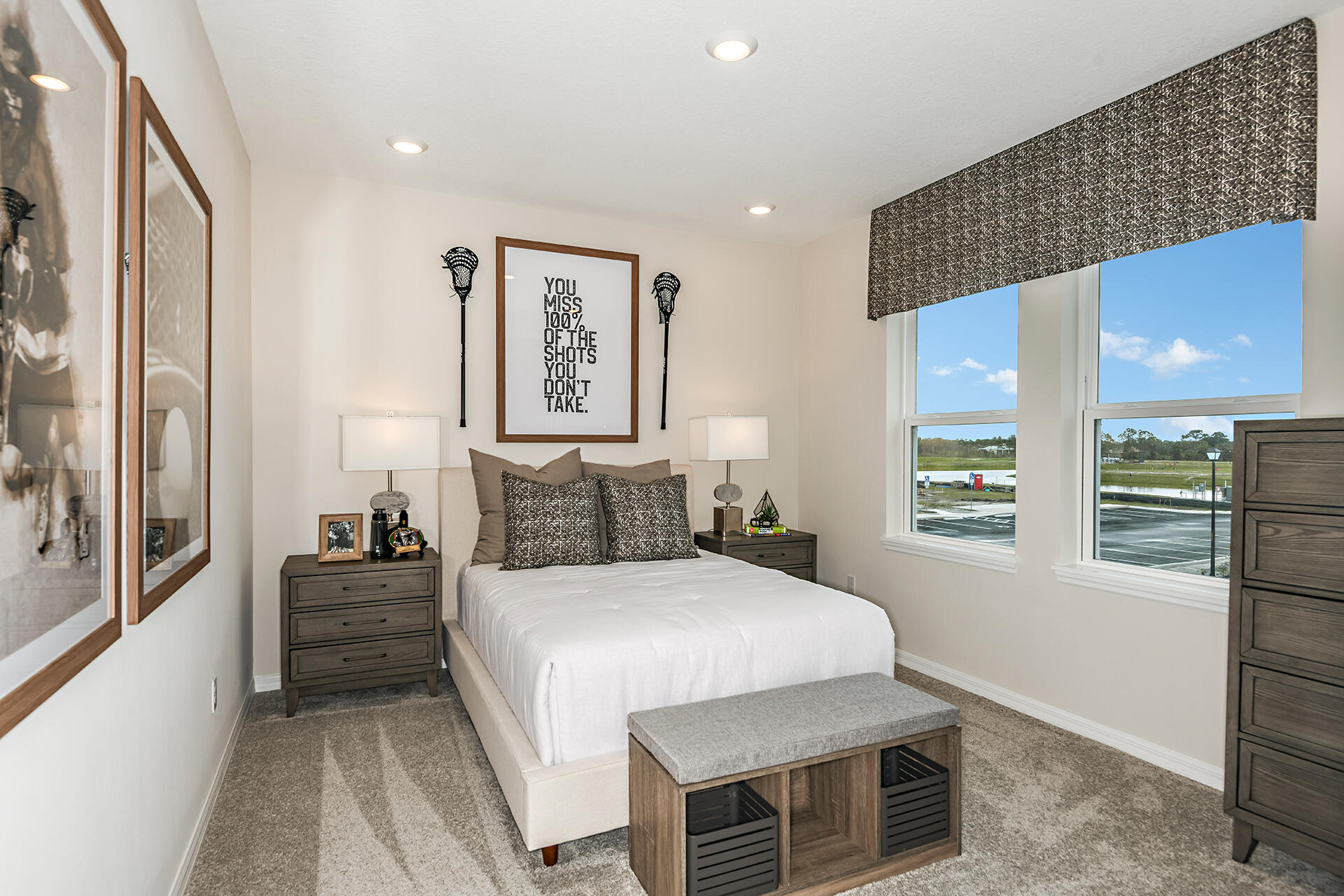 593 Southeast Ranch Oak Circle Port St. Lucie, FL 34984 - Photo 24 of 35 a bedroom with a bed and a refrigerator