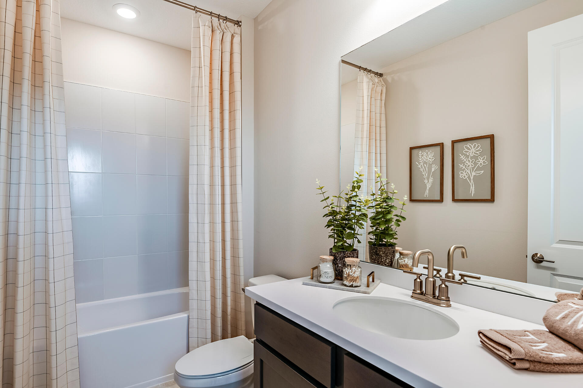 593 Southeast Ranch Oak Circle Port St. Lucie, FL 34984 - Photo 25 of 35 a bathroom with a sink toilet and shower