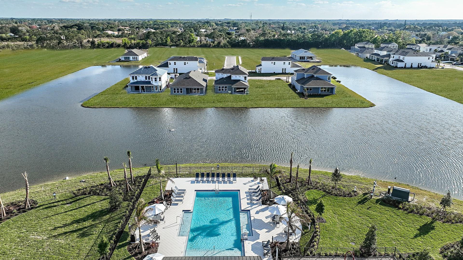 593 Southeast Ranch Oak Circle Port St. Lucie, FL 34984 - Photo 28 of 35 an aerial view of a house with a lake view
