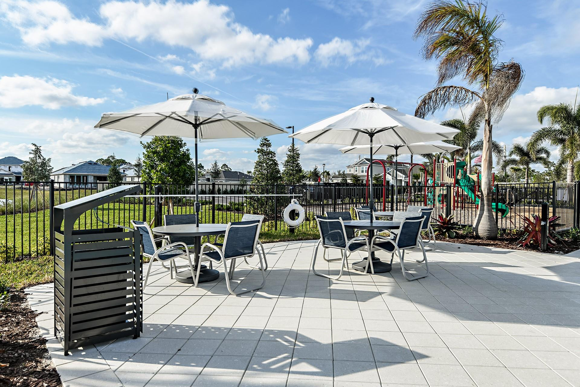 593 Southeast Ranch Oak Circle Port St. Lucie, FL 34984 - Photo 32 of 35 a view of a patio with a table and chairs
