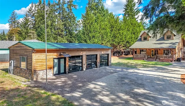 a view of a house with a yard and balcony