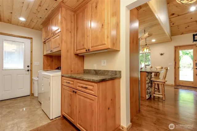 a kitchen with stainless steel appliances granite countertop a stove and a refrigerator