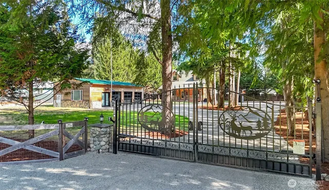 a view of a house with a wooden deck