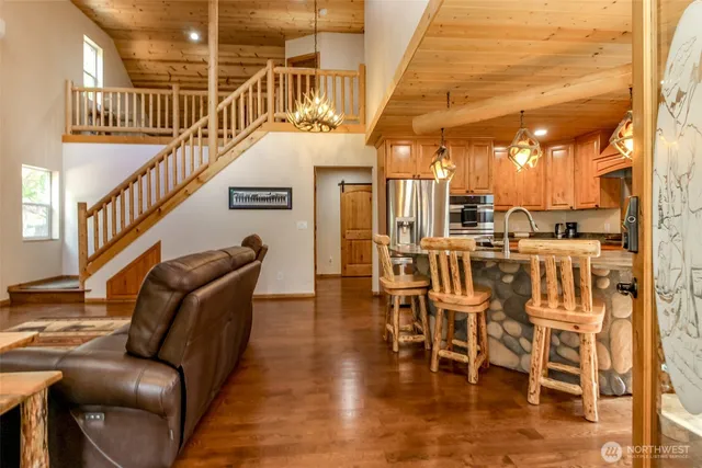 a view of a livingroom with furniture and wooden floor