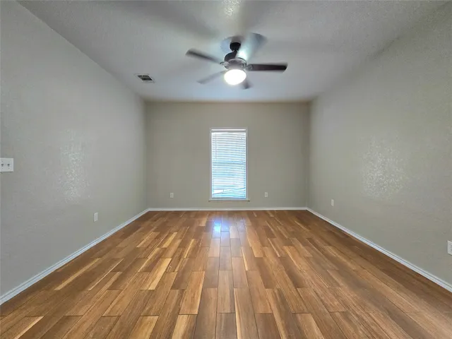a kitchen with granite countertop stainless steel appliances and wooden cabinets
