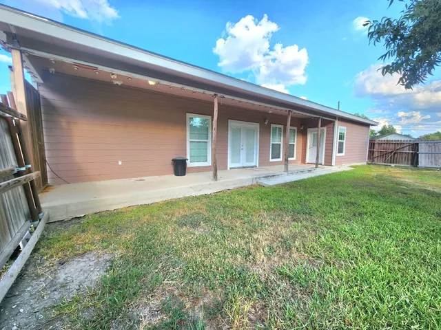 a view of a patio with a garden