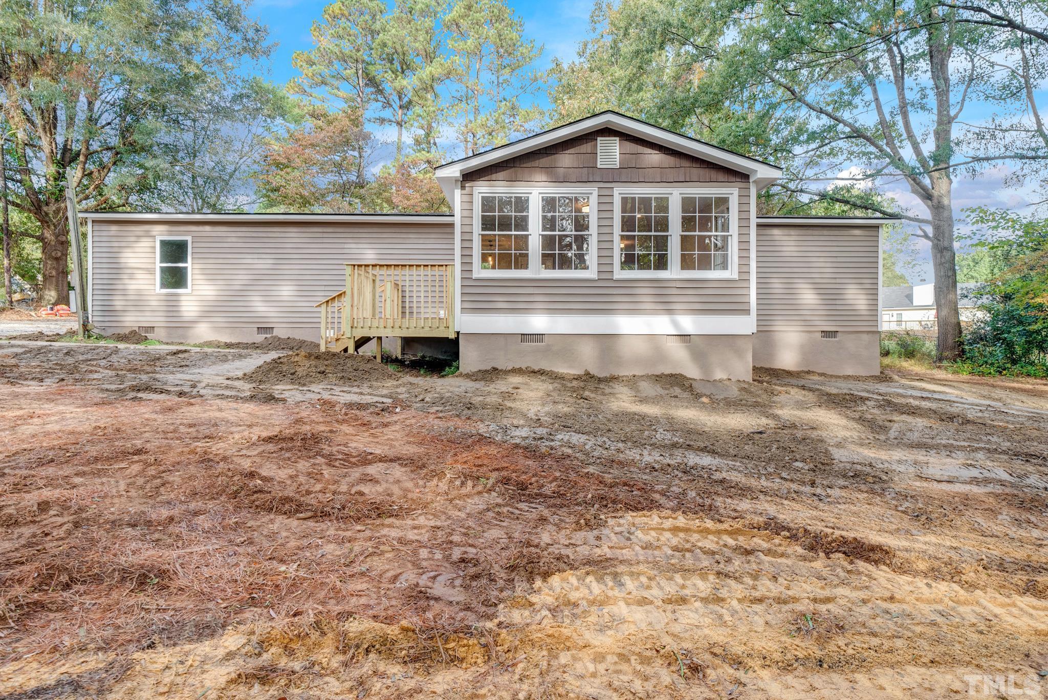 10844 Old Stage Road Raleigh, NC 27603 - Photo 1 of 17 a front view of a house with a yard