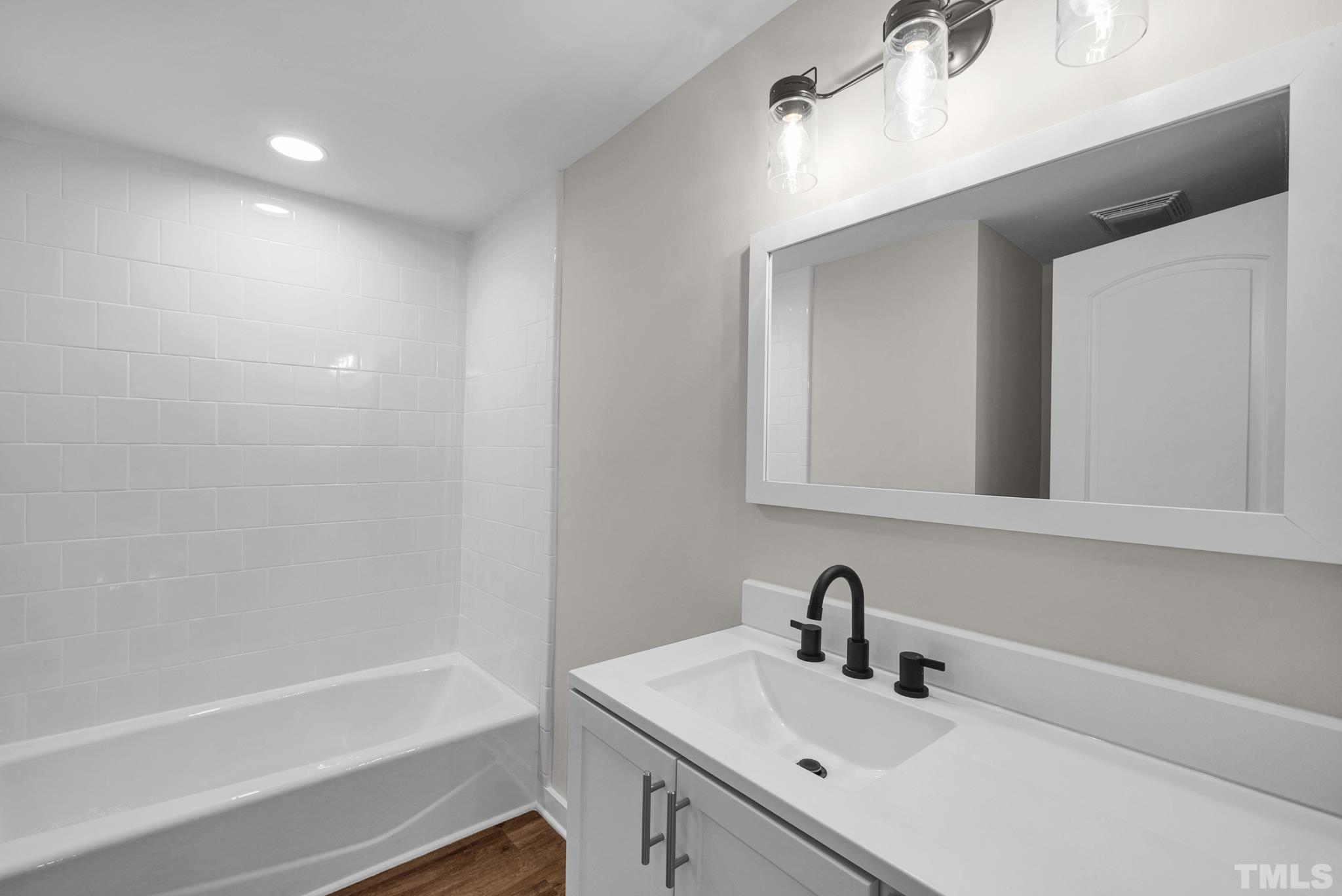 10844 Old Stage Road Raleigh, NC 27603 - Photo 11 of 17 a bathroom with a sink and a bathtub