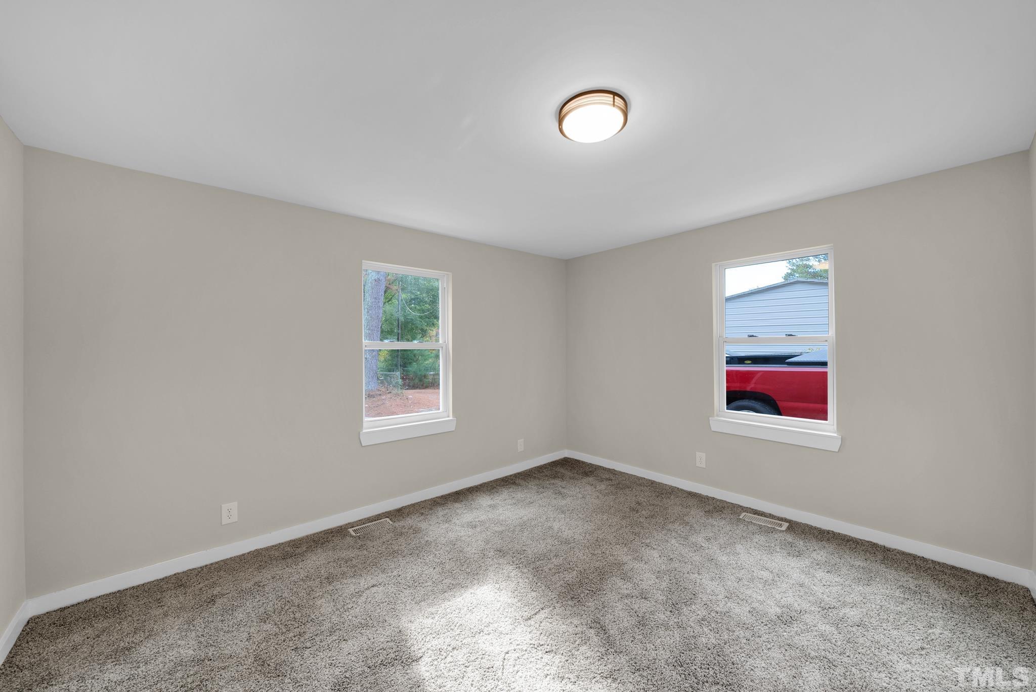 10844 Old Stage Road Raleigh, NC 27603 - Photo 13 of 17 an empty room with windows