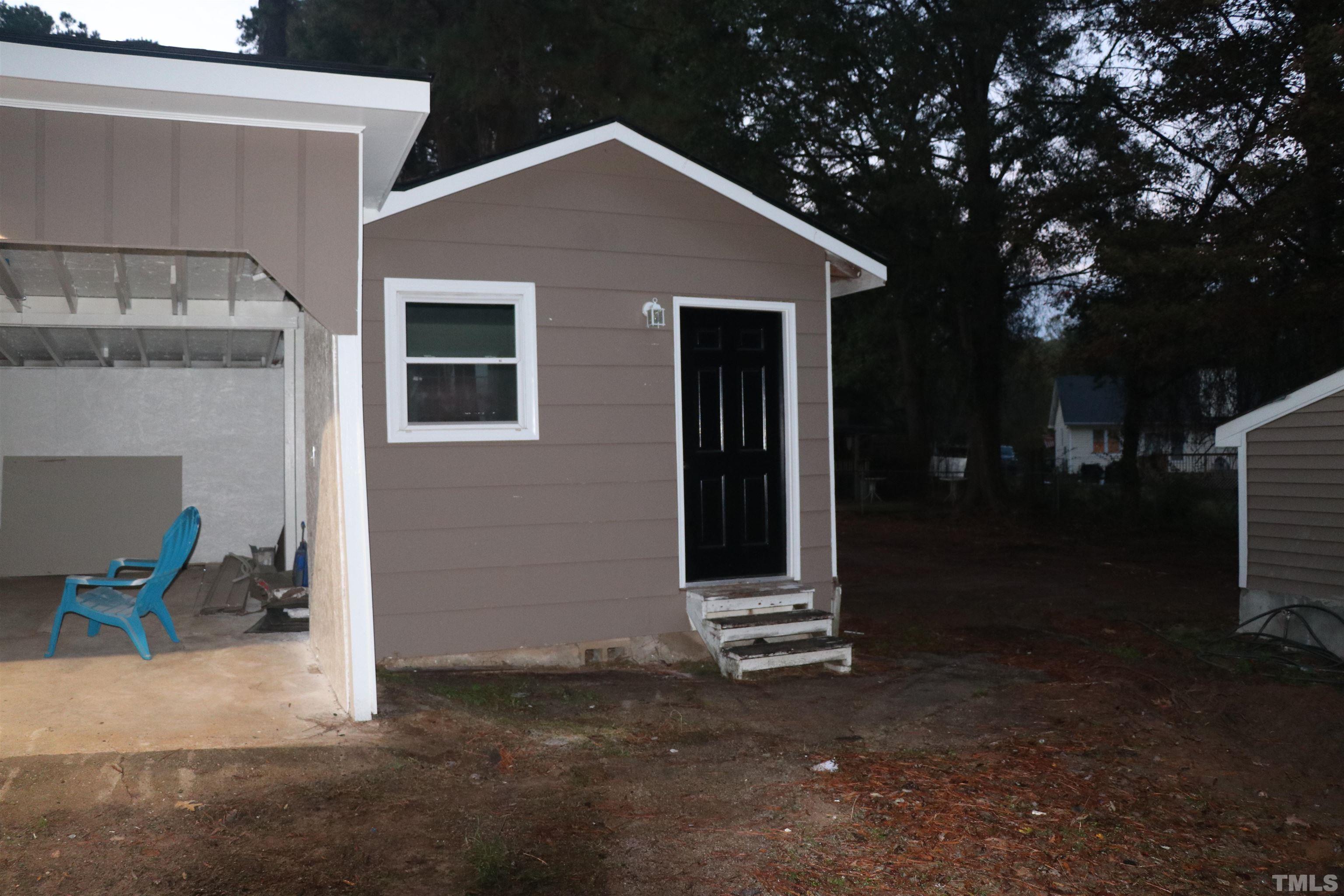 10844 Old Stage Road Raleigh, NC 27603 - Photo 16 of 17 a front view of a house with garden