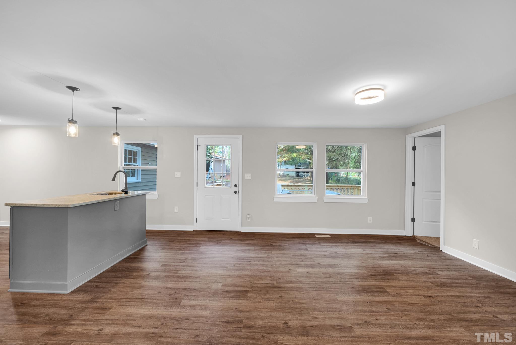 10844 Old Stage Road Raleigh, NC 27603 - Photo 3 of 17 a view of kitchen with window and wooden floor