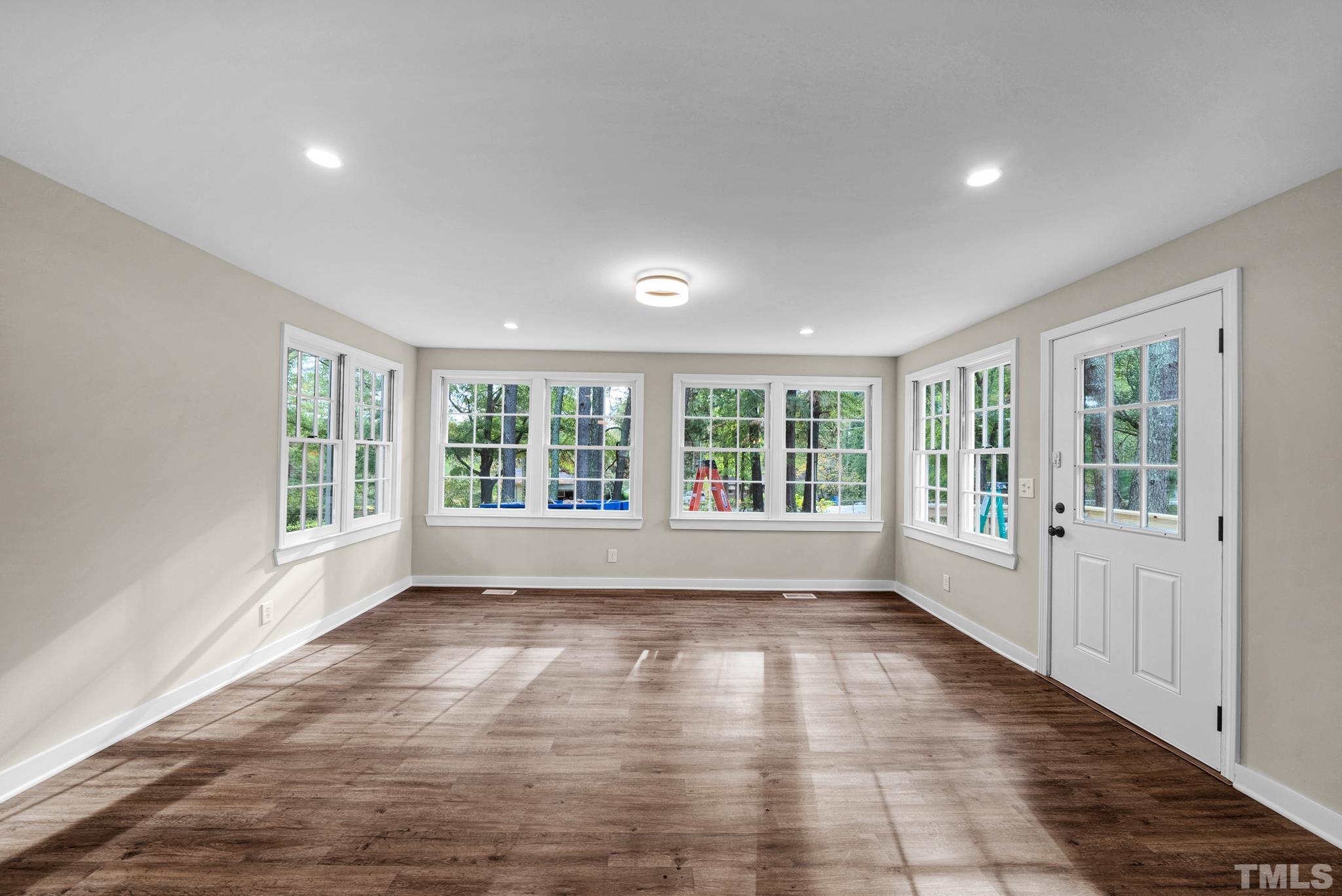 10844 Old Stage Road Raleigh, NC 27603 - Photo 4 of 17 a view of empty room with wooden floor and fan