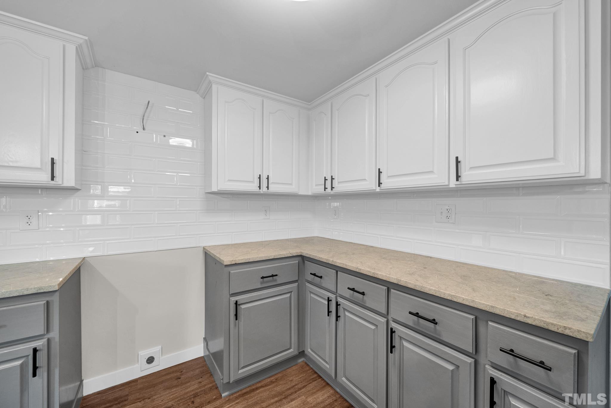 10844 Old Stage Road Raleigh, NC 27603 - Photo 8 of 17 a kitchen with granite countertop white cabinets and white appliances