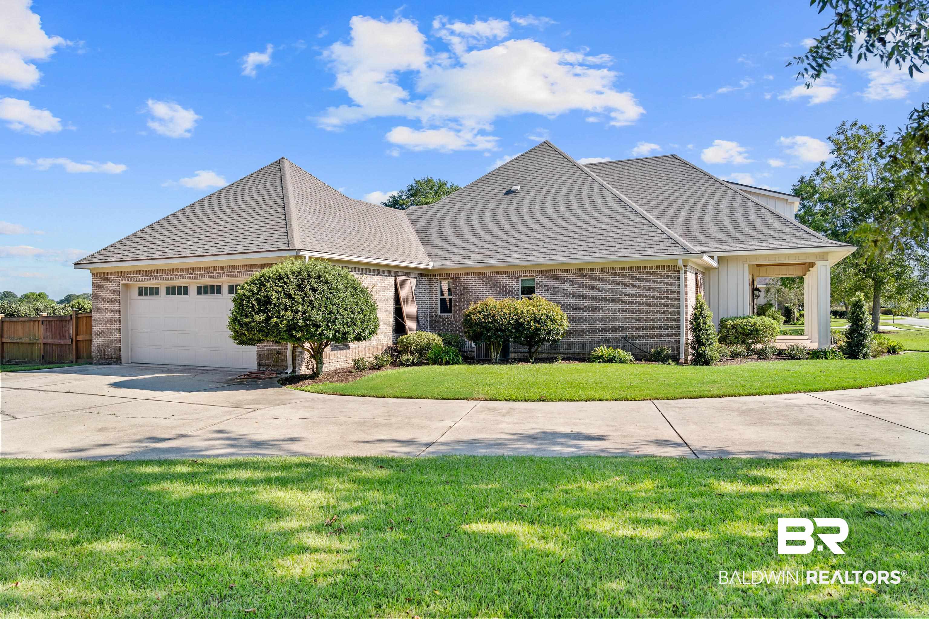 17663 Burwick Loop Fairhope, AL 36532 - Photo 4 of 41 View of front of house with a front yard and a garage