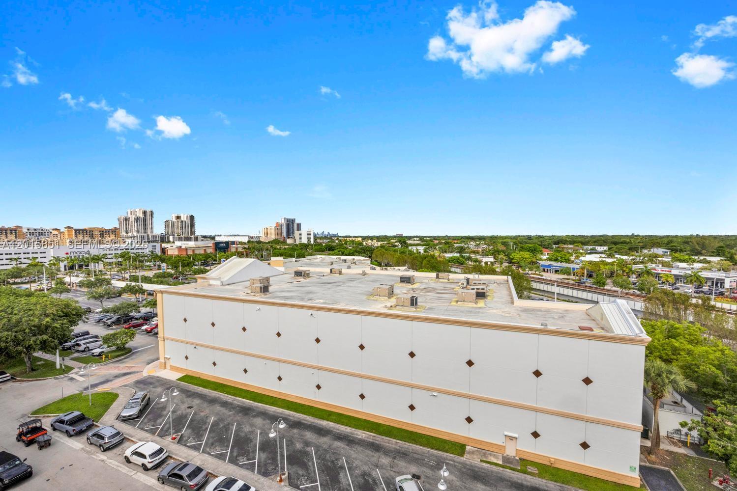 7275 Southwest 90th Street, Unit C719 Miami, FL 33156 - Photo 22 of 25 a view of a city from a terrace