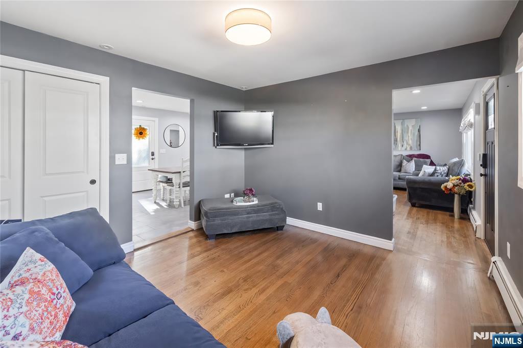 34 William Street Wallington, NJ 07057 - Photo 12 of 26 a living room with furniture and a wooden floor