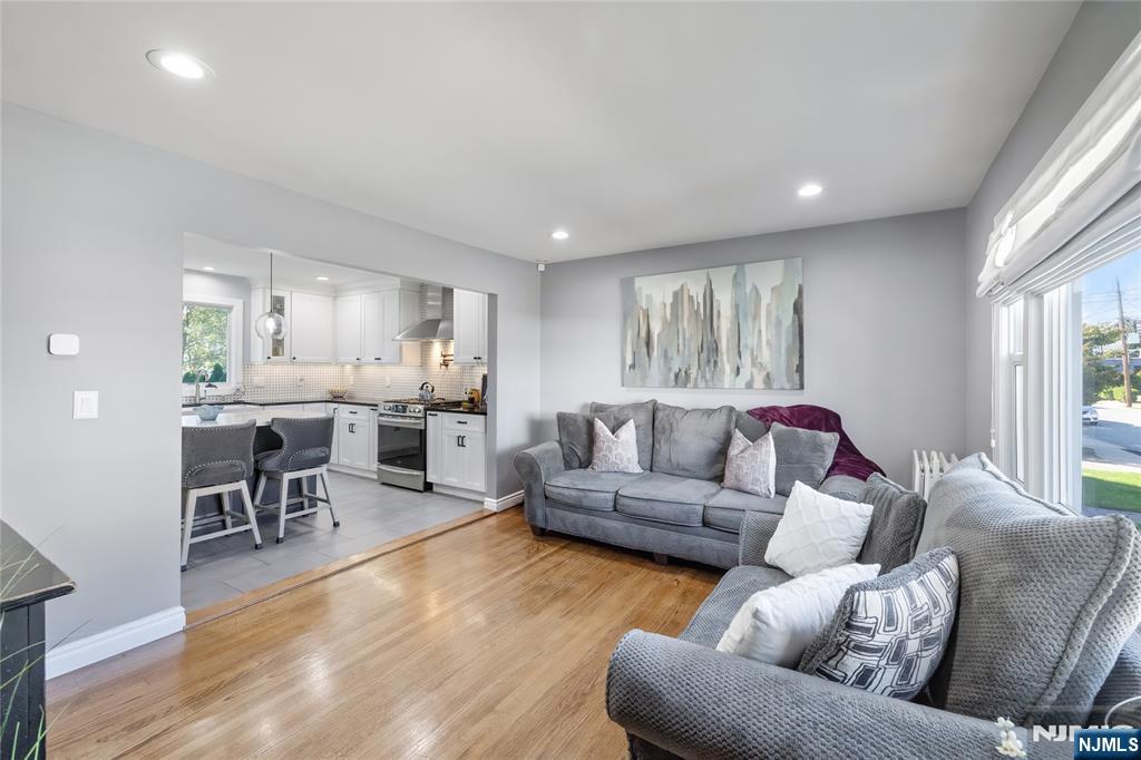 34 William Street Wallington, NJ 07057 - Photo 14 of 26 a living room with furniture and a wooden floor