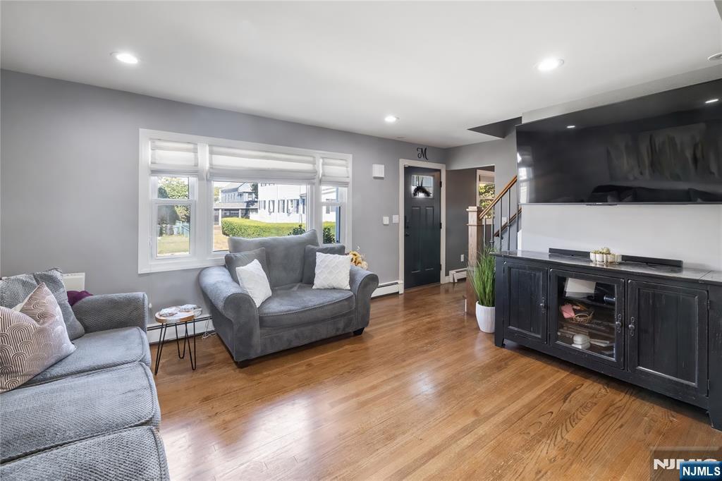 34 William Street Wallington, NJ 07057 - Photo 15 of 26 a living room with furniture and a fireplace